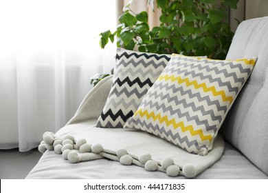 Pillows on sofa in room