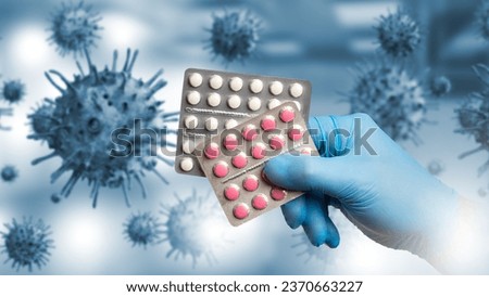 Pills against virus. Blisters with medicine in doctor hand. Molecules of infection. Disease-causing bacteria. Fighting viral diseases. Antiviral drugs. Pharmaceutical industry. Pills to kill virus
