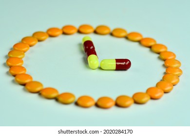 pills are arranged in a clock shape.
