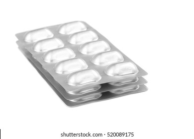 Pills in blister packs isolated on white background.