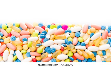 pills border over white. colorful pills isolated on white