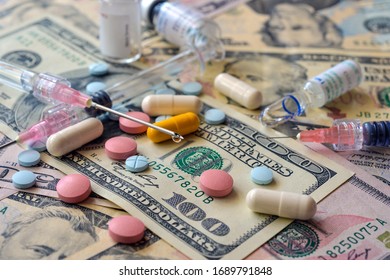 A lot of pills and capsules lie on the banknotes. Tax deduction for expenses for expensive treatment