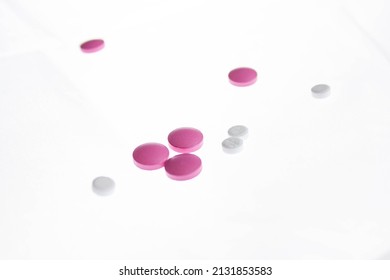 Pills close-up on a white bright background. Tablets isolated.