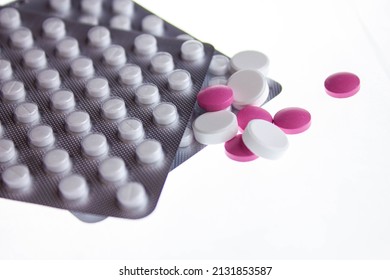 Pills close-up on a white bright background. Tablets isolated.