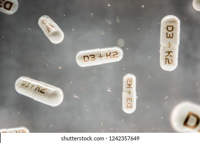 Pills Float In The Air With Inscription D3 + K2 Vitamins