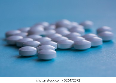 pills isolated on blue  background