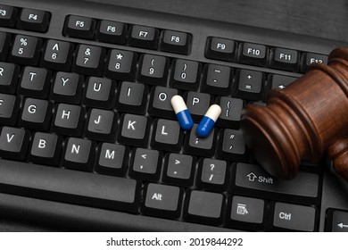 Pills And Judge Gavel On Keyboard. Online Sale Of Drugs Is Illegal