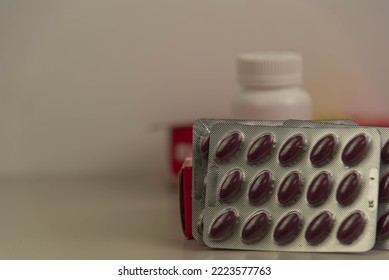 Pills and medicine bottles on neutral background. Medicines for oral use. Medicine bottles and pill packs. Items used for human health. Hospital supplies. - Shutterstock ID 2223577763