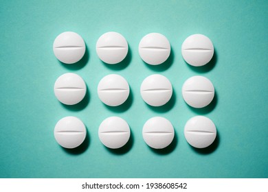 Pills on a green table. - Shutterstock ID 1938608542