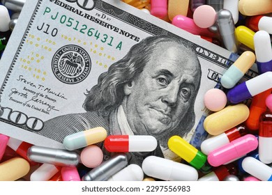 Pills on money dollars - Medicine prescription drugs cost concept - healthcare insurance expenses  - Powered by Shutterstock