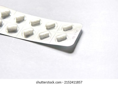 pills packaged in panels placed on a white background