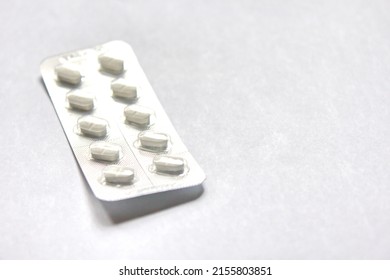 pills packaged in panels placed on a white background