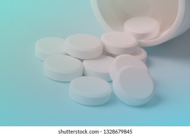 Pills Pouring Out Of The Medicine Bottle; Safe Drug Use And Medical Treatment Concept. Selective Focus