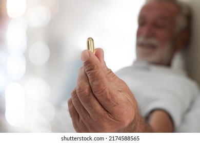 Pills In A Senior's Hands. Painful Old Age. Caring For The Health Of The Elderly.