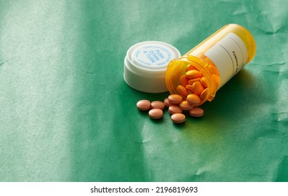 Pills Spill From Medicine Tablet Bottle 