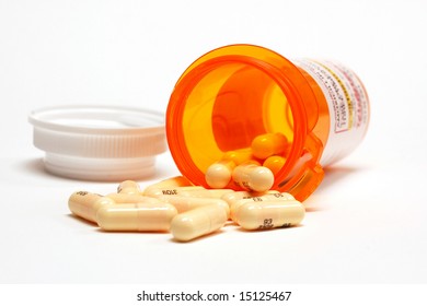 Pills Spilling Out From A Prescription Bottle