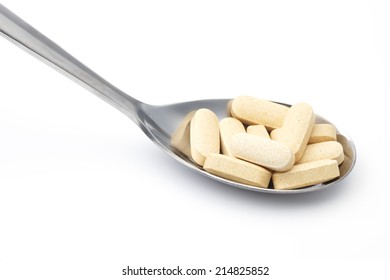 Pills in spoon