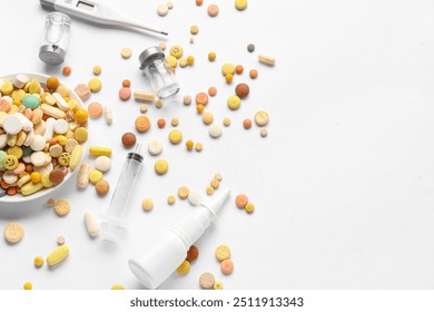 Pills, syringes, ampules and digital thermometer on white background - Powered by Shutterstock