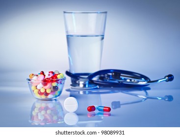 Pills And Tablets Macro Still Life On White Blue, Medical Therapeutic Concept