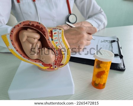 Pills and vitamins during pregnancy artificial insemination and gynecologist. Fetal health and embryo protection Stock photo © 