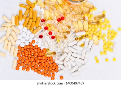 Pills and vitamins on a white background. Different drugs in capsules and tablets. Copy space - Shutterstock ID 1400407439