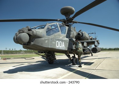 A Pilot Climbs Off Of His Apache Longbow