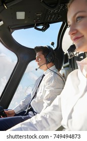 Pilot And Co Pilot In Cockpit Of Helicopter