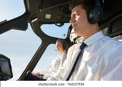 Pilot And Co Pilot In Cockpit Of Helicopter