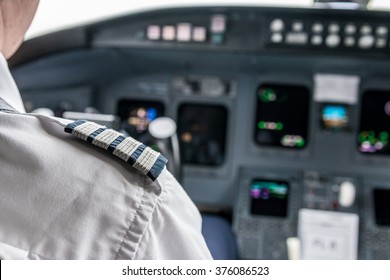 Pilot In Cockpit Flying