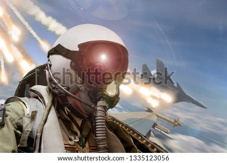 Pilot cockpit view during air to air combat with missiles flares chaff being deployed