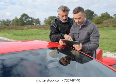 pilot and engineer checking last races performances durint tests
