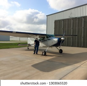 Pilot Entering Small Airplane