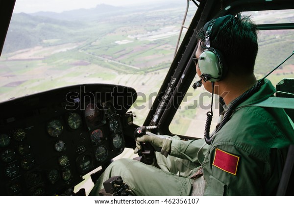 Pilot Flying Helicopter Looking Outside Window : Foto de stock ...
