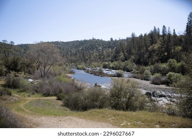 Pilot Hill, CA, USA - April 3, 2022:  Vistas of Corcoran Ranch rolling hilss and American River.