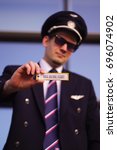 Pilot holds a keychain IOSA BEFORE FLIGHT