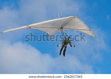 Pilot learning to fly on vintage rogallo hangglider wing