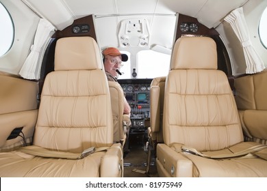 Pilot Looking Back At Passenger Compartment In A Cessna Twin Engine Airplane