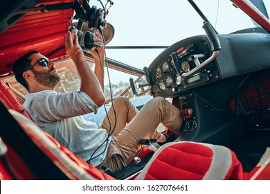 A Pilot Prepares For Take Off On A Small Airplane . Side View