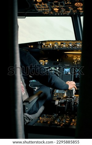 pilot pressing the gas pedal in the cockpit of jet plane during a flight or flight simulator training