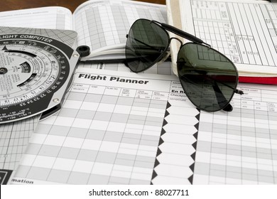 Pilot Style Sunglasses On A Flight Plan Paper