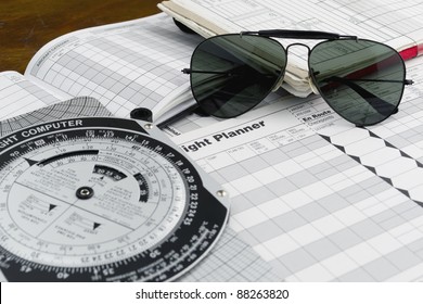 Pilot Style Sunglasses On A Flight Plan Paper