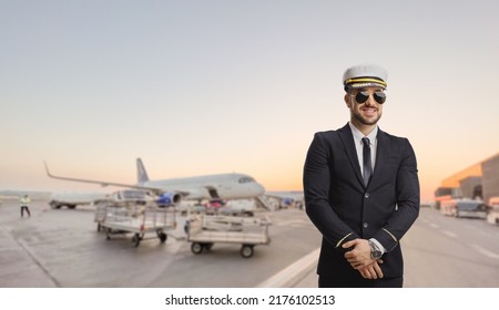 Pilot With A Sunglasses Posing On An Airport Apron