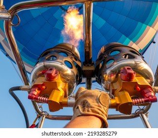 The Pilot's Arm Includes Gas Equipment To Fill The Balloon Dome With Hot Air.Bright Burning Flame Inside The Air Balloon