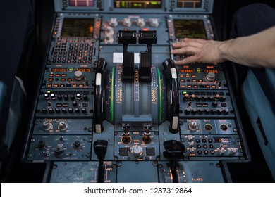 Pilot's Hand Accelerating On The Throttle In  A Commercial Airliner Airplane Flight Cockpit During Takeoff