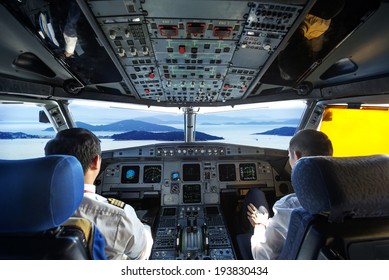 Pilots In The Plane Cockpit