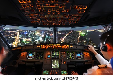 Pilots In The Plane Cockpit