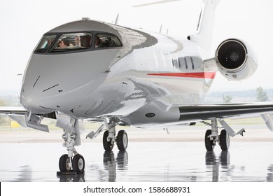 Pilots In Private Jet In Hangar