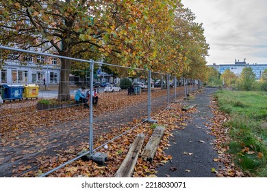 Pilsen, Czech Republic - October 23 2022: Autumn Sidewalk With Fallen Tree Leaves With Parked Cars By The Side Of The Road