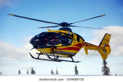 Pilsko, Hala Miziowa, Poland - February 26, 2021:Rescue operation of GOPR Beskidy and HEMS Ratownik 4, with the use of an air ambulance helicopter.