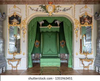 PILSRUNDALE, LATVIA, March 24, 2019: Interior Of Rundale Palace - The Duke’s Bedroom. The Parquet Floor, Ceiling Painting, Green Walls.